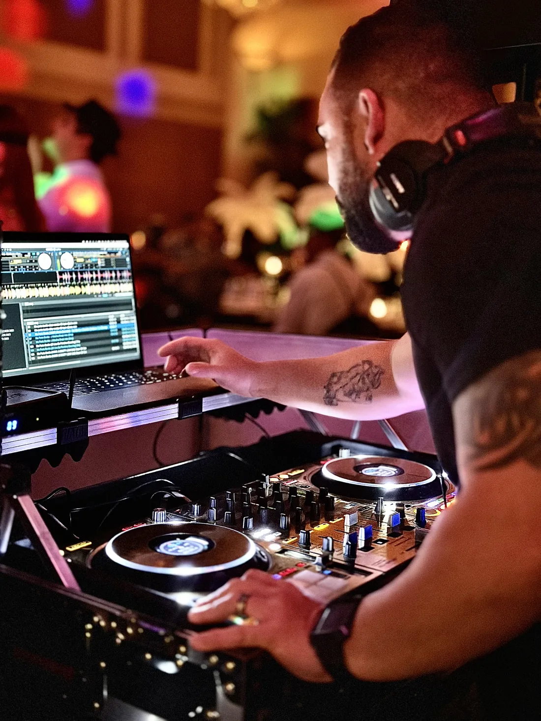 DJ Legendz mixing live on the decks at an event
